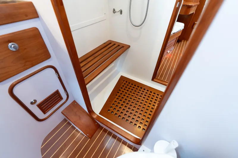 Solitude Yacht Photos Pics Luxurious wooden interior of 2018 Passport Vista 545 Center Cockpit yacht bathroom.