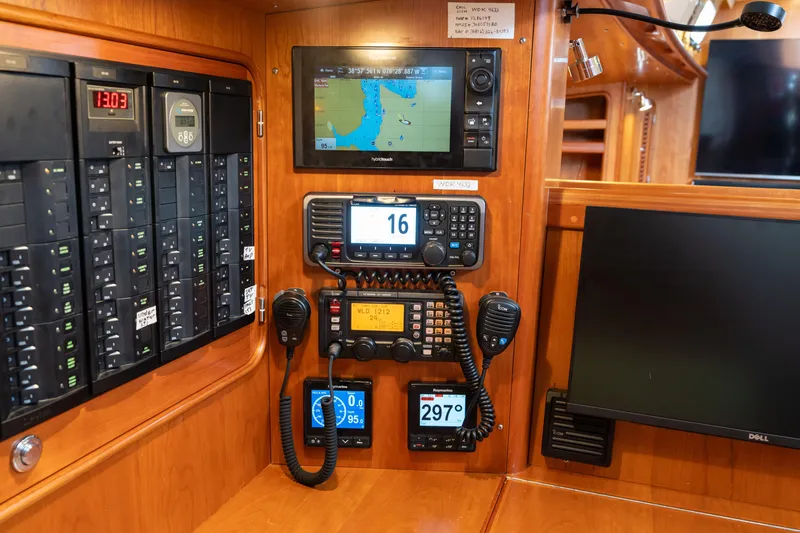 Solitude Yacht Photos Pics Control panel of 2018 Passport Vista 545 Center Cockpit with navigation and communication equipment.