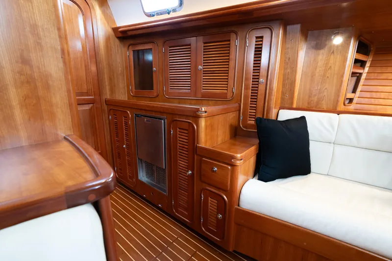 Solitude Yacht Photos Pics Luxurious wooden interior of 2018 Passport Vista 545 Center Cockpit yacht with seating area.