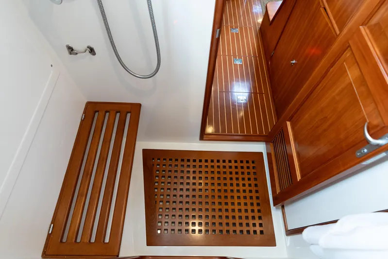 Solitude Yacht Photos Pics Wooden interior of 2018 Passport Vista 545 Center Cockpit yacht bathroom.