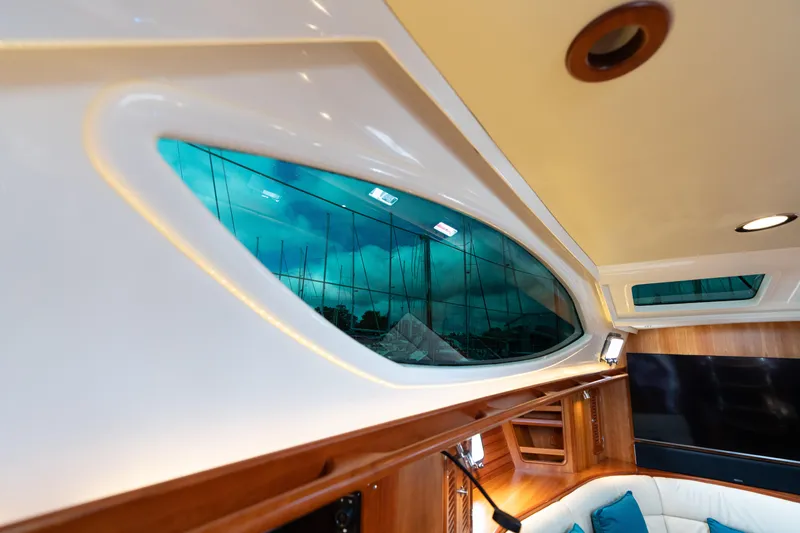 Solitude Yacht Photos Pics Interior of 2018 Passport Vista 545 Center Cockpit yacht with stylish windows and seating.