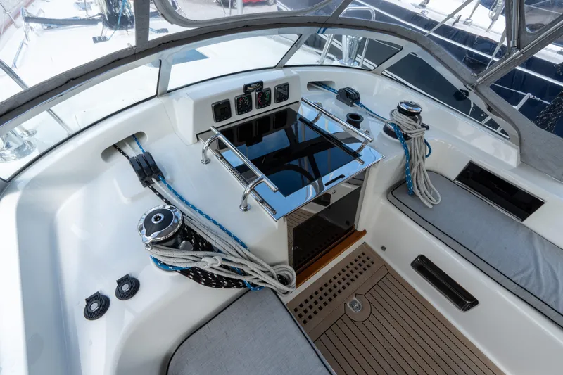 Solitude Yacht Photos Pics Center cockpit of 2018 Passport Vista 545 sailboat with winches and navigation instruments.