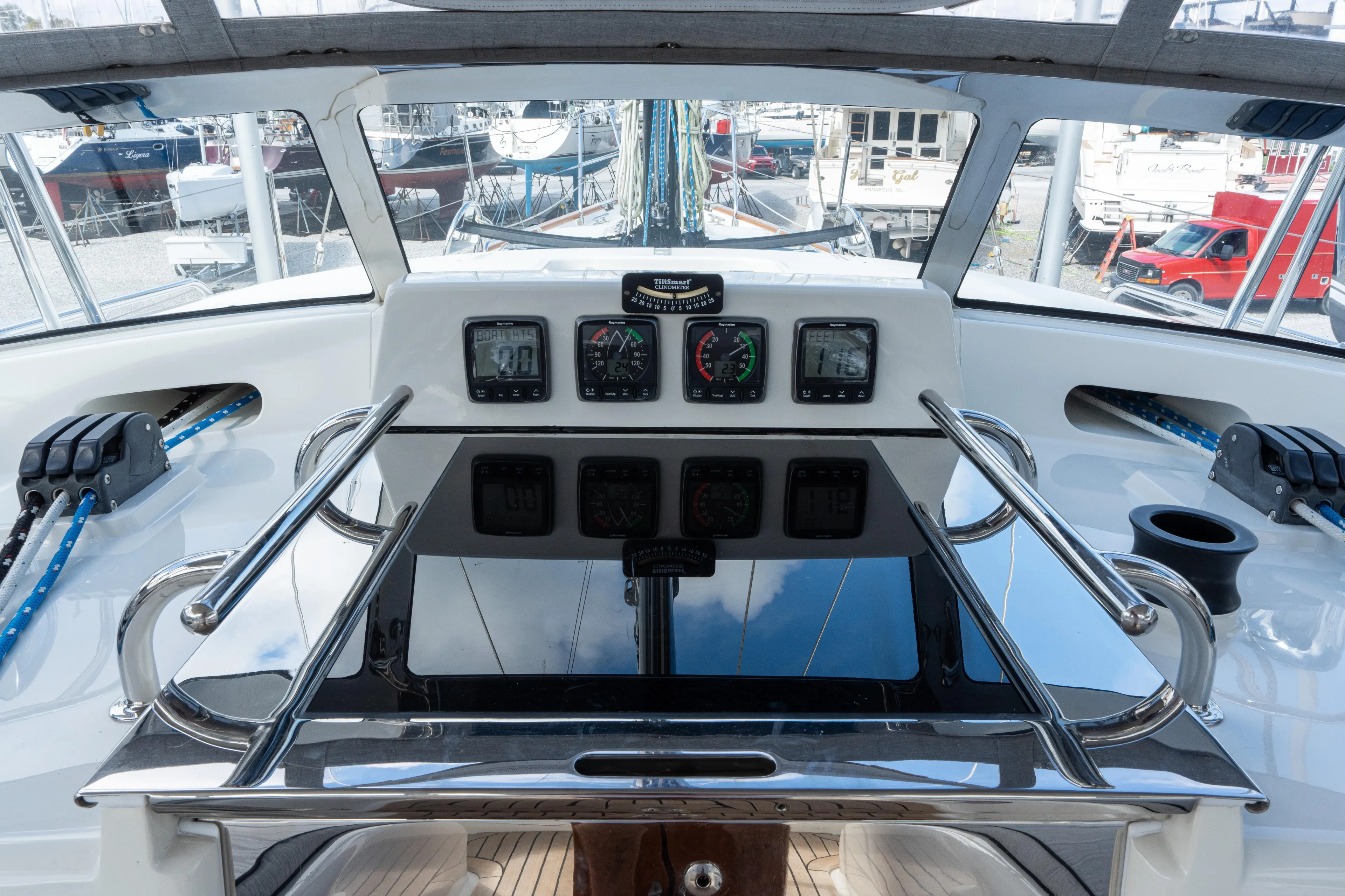 Solitude Yacht Photos Pics Cockpit view of 2018 Passport Vista 545 Center Cockpit yacht with navigation instruments.