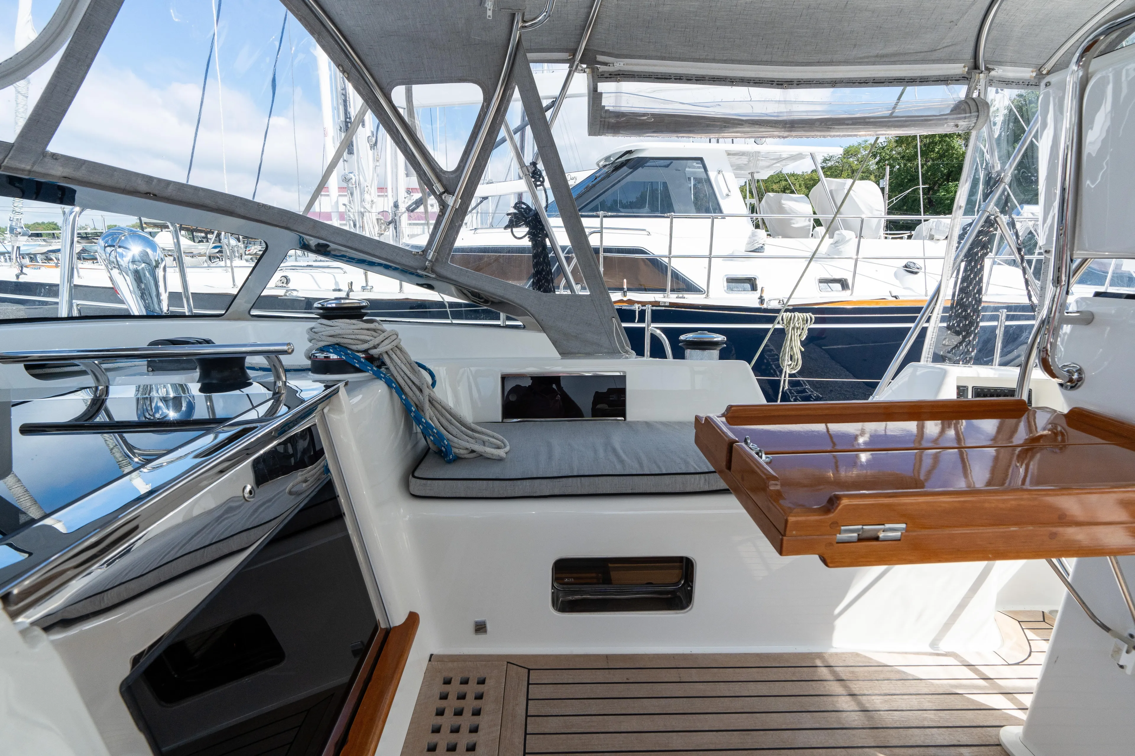 Solitude Yacht Photos Pics 2018 Passport Vista 545 Center Cockpit with sleek design and wooden accents in marina setting.