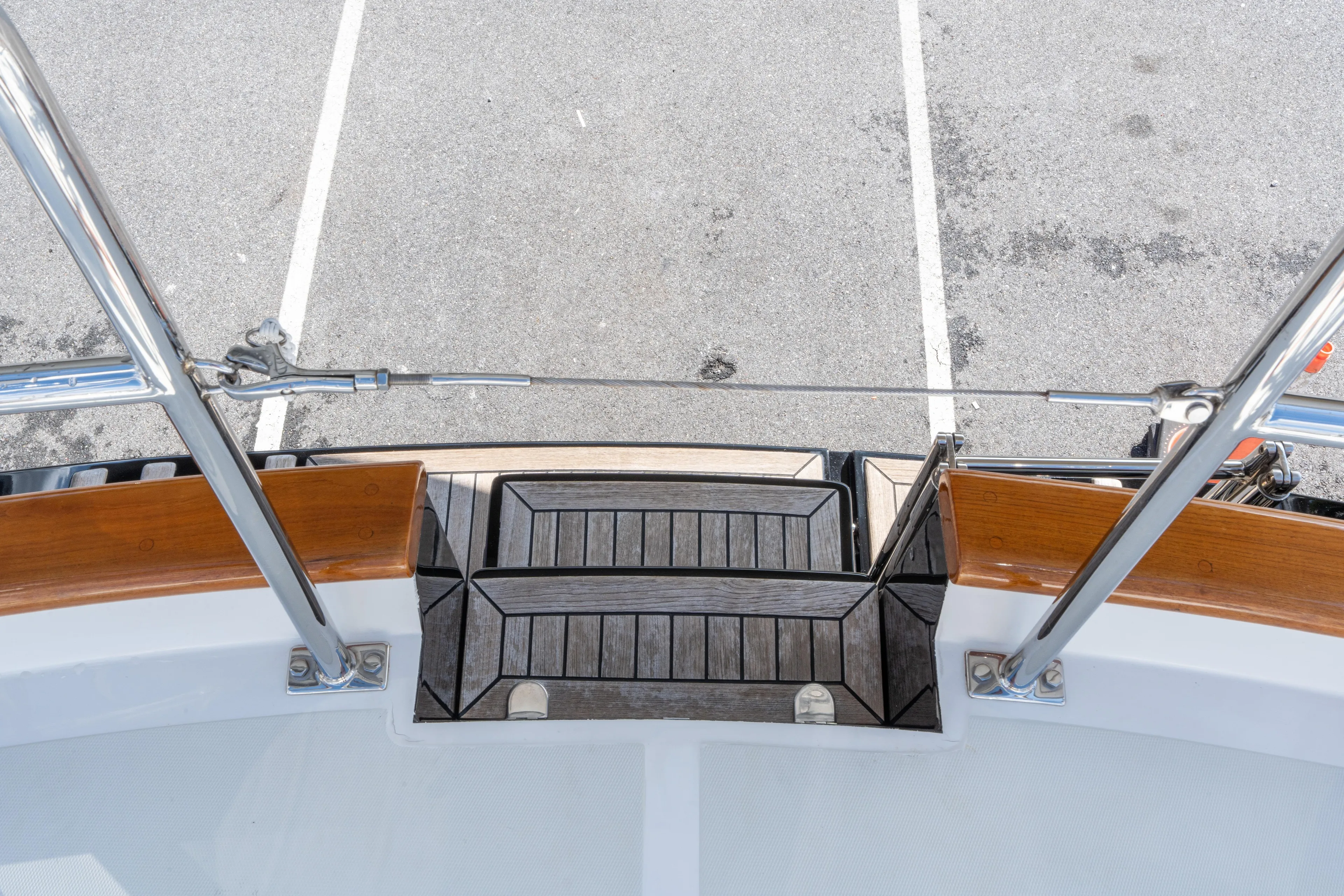 Solitude Yacht Photos Pics 2018 Passport Vista 545 Center Cockpit yacht deck with wooden steps and metal railings.