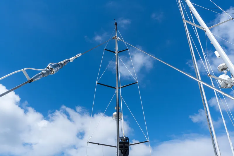 Solitude Yacht Photos Pics Mast and rigging of 2018 Passport Vista 545 Center Cockpit against blue sky.