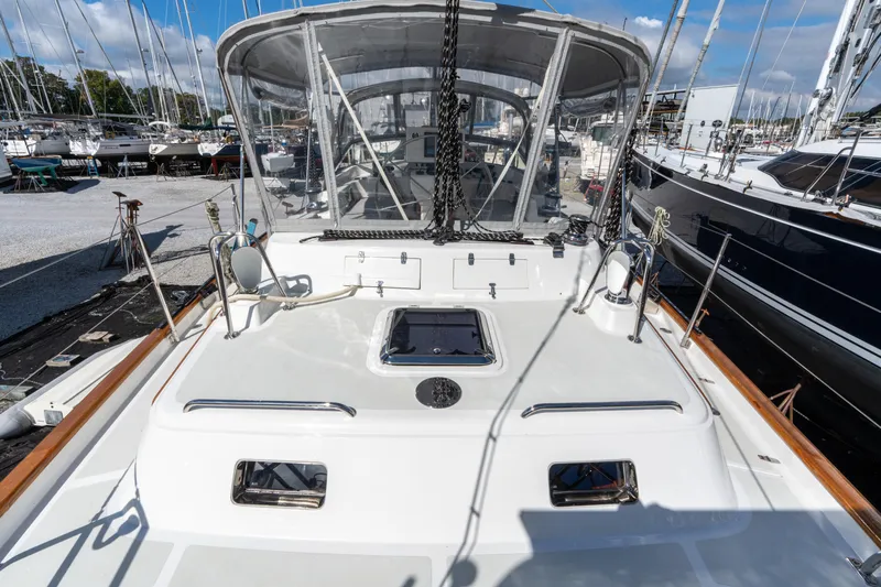 Solitude Yacht Photos Pics 2018 Passport Vista 545 Center Cockpit sailboat docked at marina, showcasing deck and cockpit area.