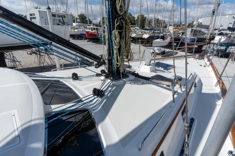 Solitude Yacht Photos Pics 2018 Passport Vista 545 Center Cockpit sailboat deck with rigging and marina background.
