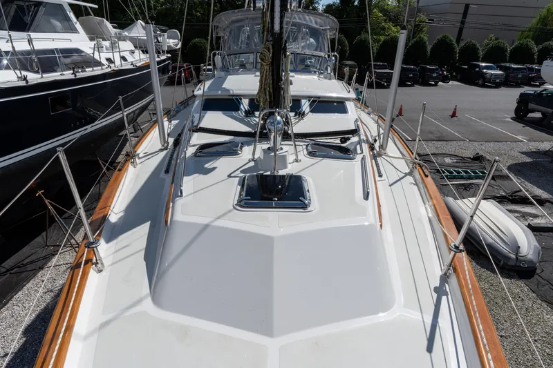 Solitude Yacht Photos Pics 2018 Passport Vista 545 Center Cockpit sailboat deck view in marina setting.