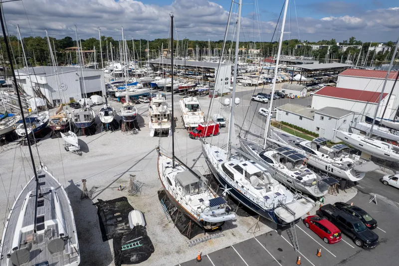 Solitude Yacht Photos Pics Boats docked at a marina, featuring a 2018 Passport Vista 545 Center Cockpit sailboat.