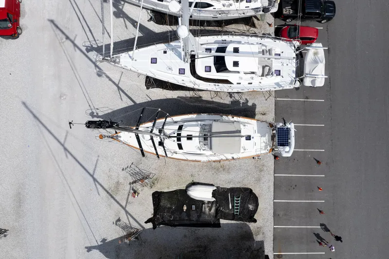 Solitude Yacht Photos Pics Aerial view of 2018 Passport Vista 545 Center Cockpit sailboat in a parking area.