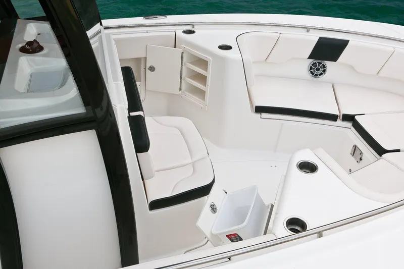  Yacht Photos Pics Manufacturer Provided Image: 2017 Robalo R302 Center Console boat interior with seating and storage compartments.
