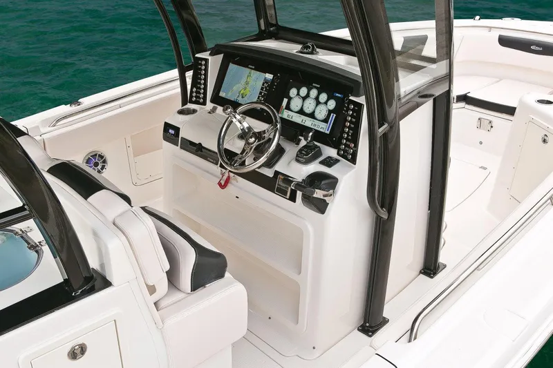  Yacht Photos Pics Manufacturer Provided Image: 2017 Robalo R302 Center Console boat dashboard with navigation equipment.