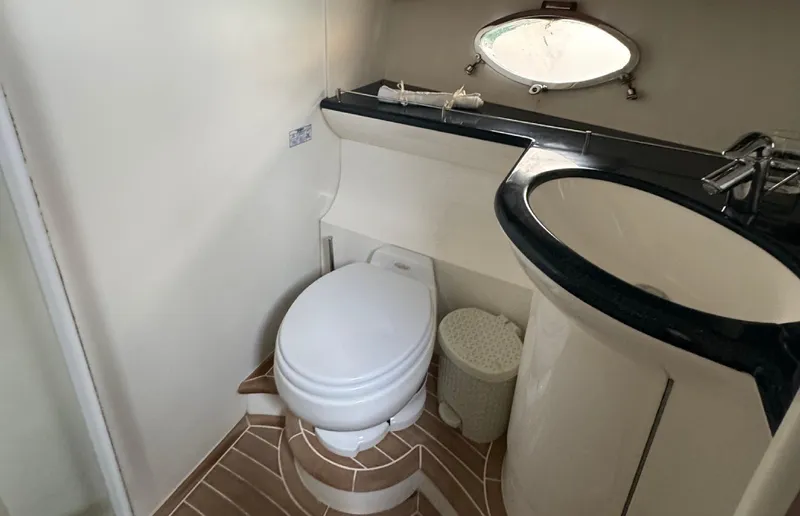 Yacht Photos Pics Bathroom interior of 2004 Princess V65 yacht with toilet and sink.