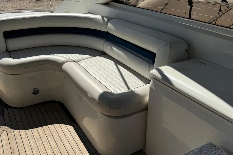 Yacht Photos Pics Luxurious seating area on a 2004 Princess V65 yacht with white leather upholstery.