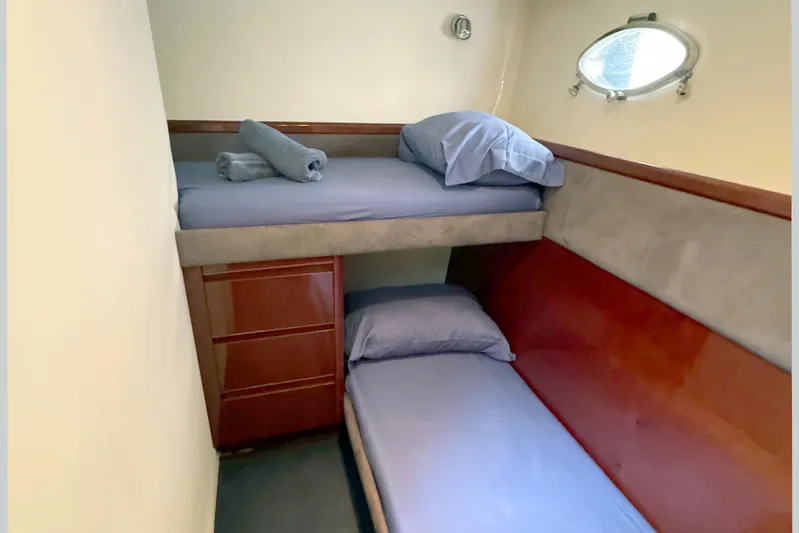  Yacht Photos Pics Compact cabin with bunk beds in 2004 Princess V65 yacht.