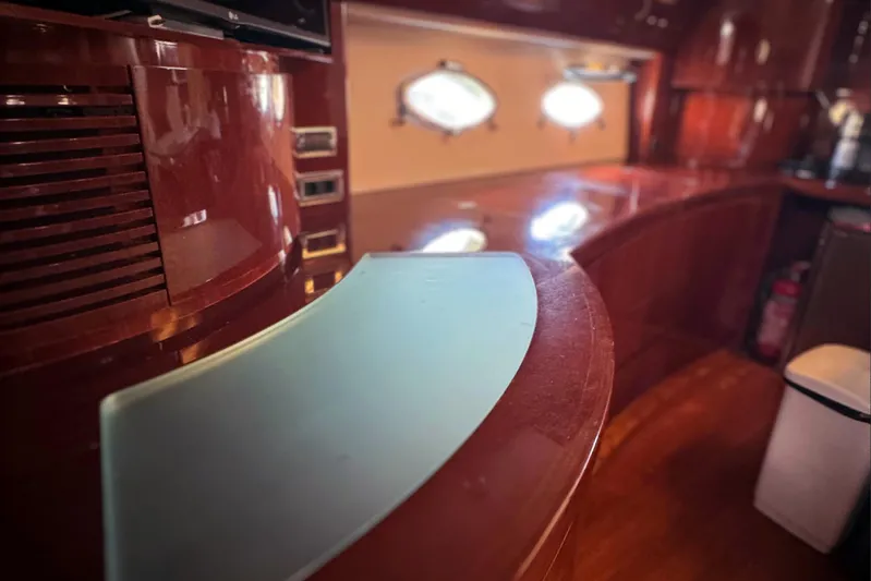  Yacht Photos Pics Luxurious interior of 2004 Princess V65 yacht with polished wood and modern design.