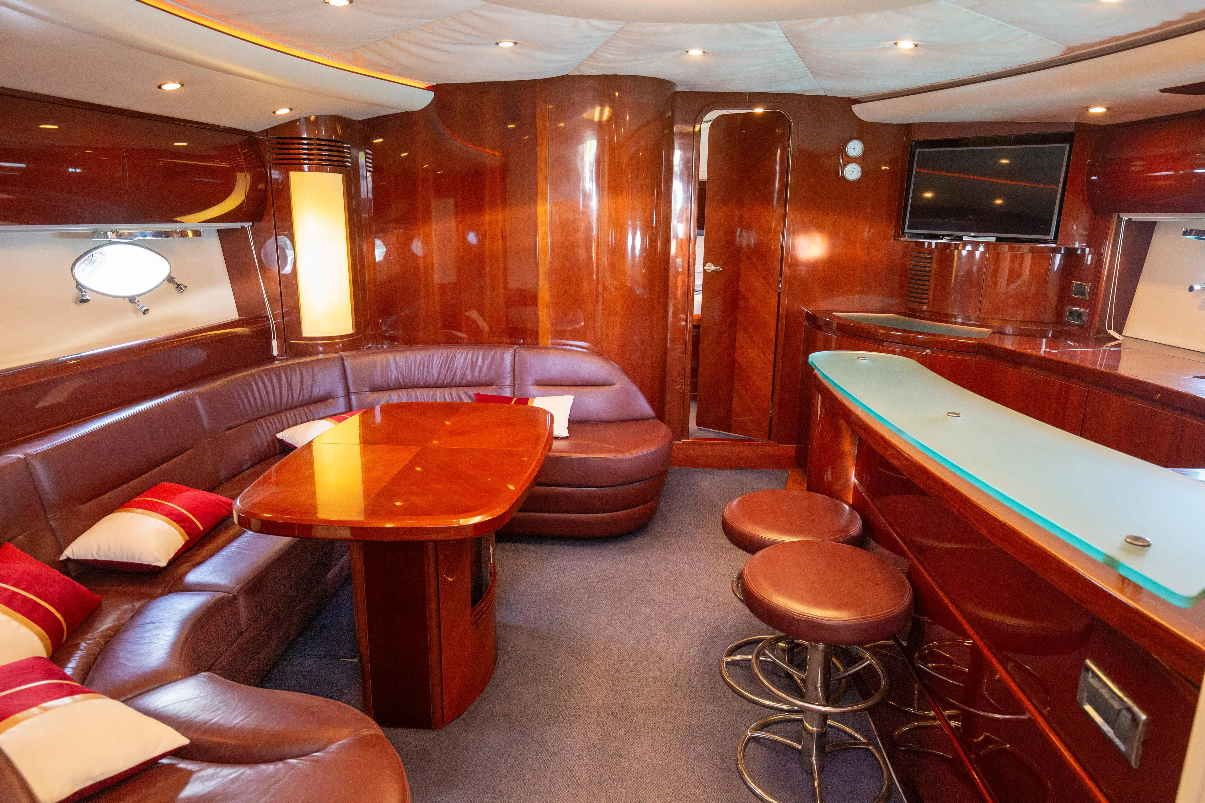  Yacht Photos Pics Luxurious 2004 Princess V65 yacht interior with leather seating, wooden finishes, and modern amenities.