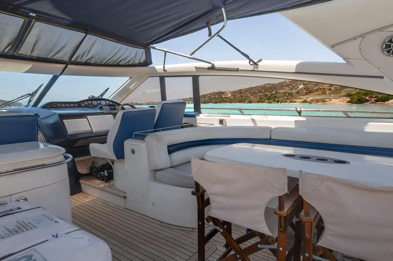  Yacht Photos Pics Luxurious 2004 Princess V65 yacht interior with seating and ocean view.