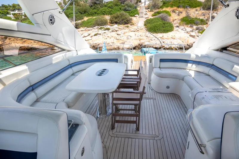  Yacht Photos Pics Luxurious 2004 Princess V65 yacht interior with elegant seating and dining area.