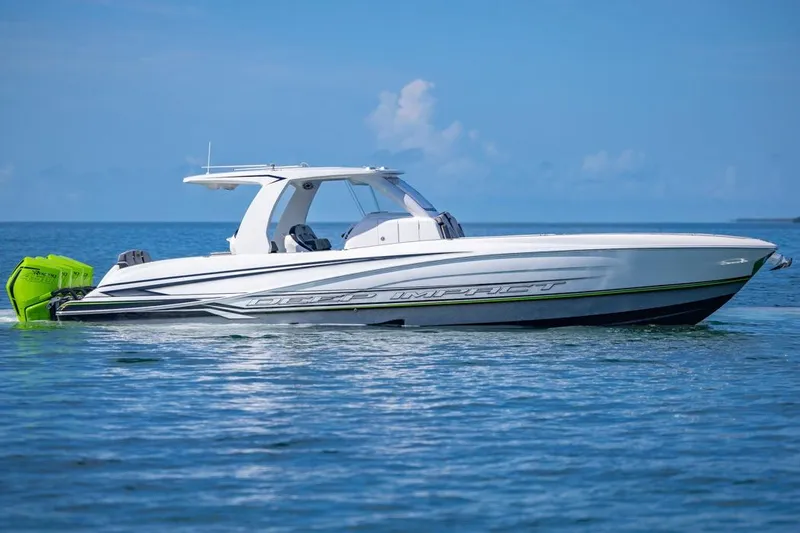  Yacht Photos Pics 2026 Deep Impact 399 Sport boat on calm blue water, featuring sleek design and vibrant engines.