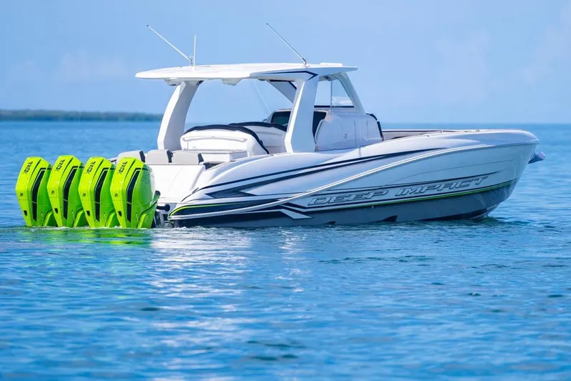  Yacht Photos Pics 2026 Deep Impact 399 Sport boat with four vibrant green outboard engines on calm water.