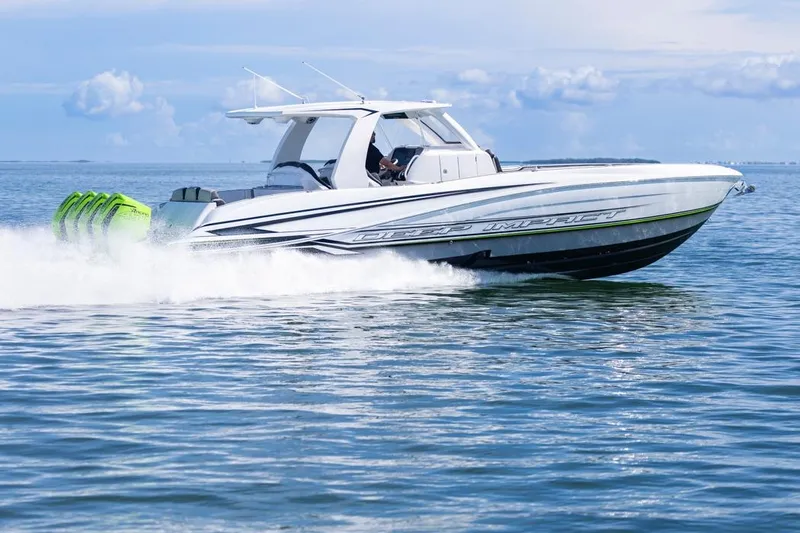  Yacht Photos Pics 2026 Deep Impact 399 Sport boat speeding on open water, showcasing sleek design and powerful engines.