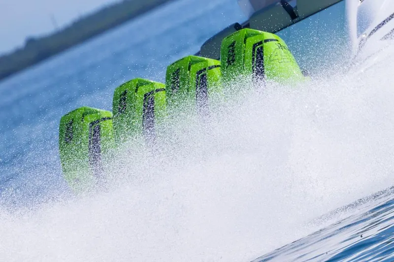  Yacht Photos Pics Five vibrant green outboard motors on a speeding Deep Impact 399 Sport boat, 2026 model.