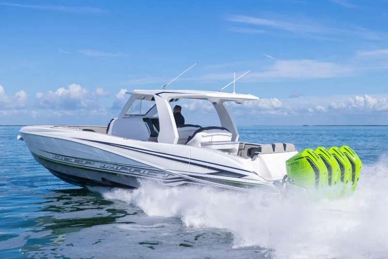  Yacht Photos Pics 2026 Deep Impact 399 Sport boat cruising on open water with vibrant engines.