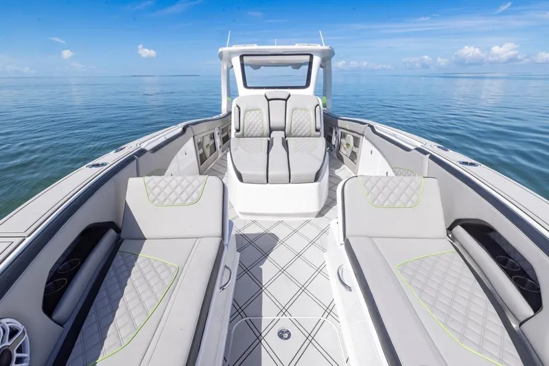  Yacht Photos Pics Luxurious 2026 Deep Impact 399 Sport boat interior with elegant seating and ocean view.