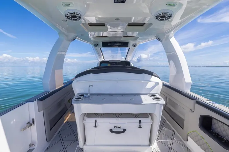  Yacht Photos Pics Interior view of 2026 Deep Impact 399 Sport boat on calm ocean waters.