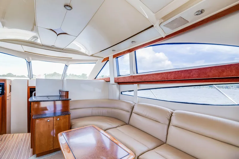  Yacht Photos Pics Luxurious interior of 2006 Meridian 341 Sedan yacht with leather seating and panoramic windows.
