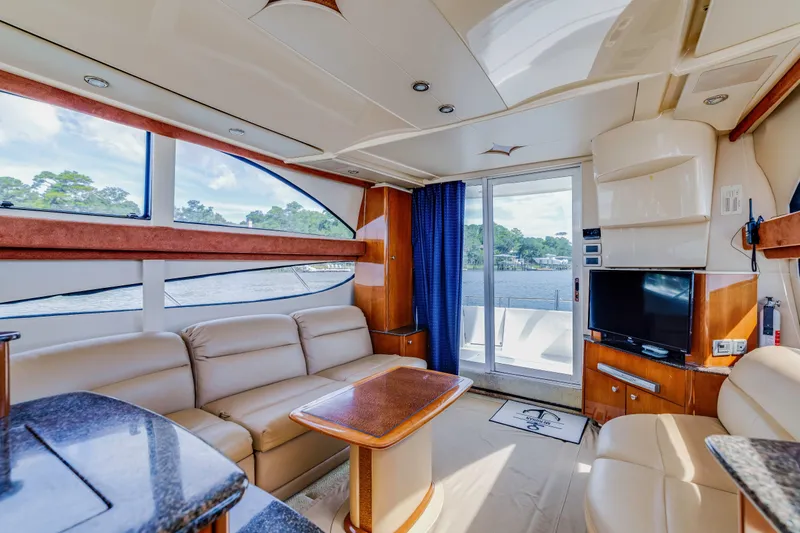  Yacht Photos Pics Luxurious interior of 2006 Meridian 341 Sedan yacht with leather seating and scenic water view.