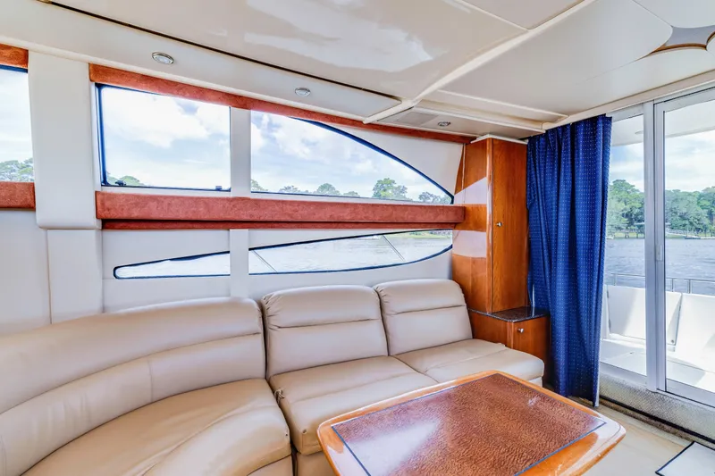  Yacht Photos Pics Luxurious interior of 2006 Meridian 341 Sedan yacht with leather seating and scenic windows.