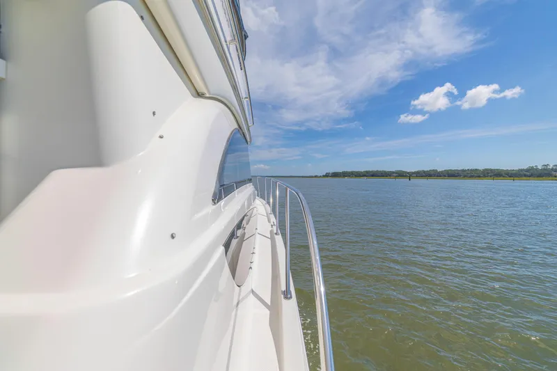  Yacht Photos Pics Side view of 2006 Meridian 341 Sedan yacht cruising on a sunny day.