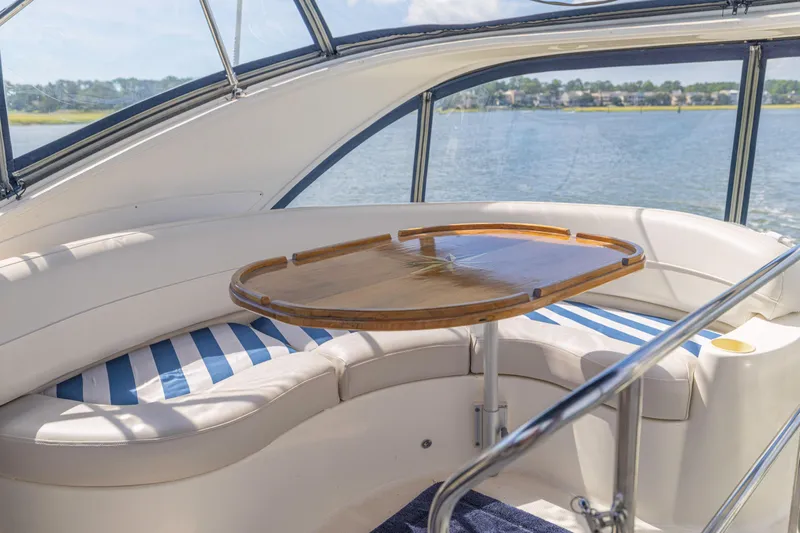  Yacht Photos Pics Luxurious seating area on a 2006 Meridian 341 Sedan yacht with scenic water view.