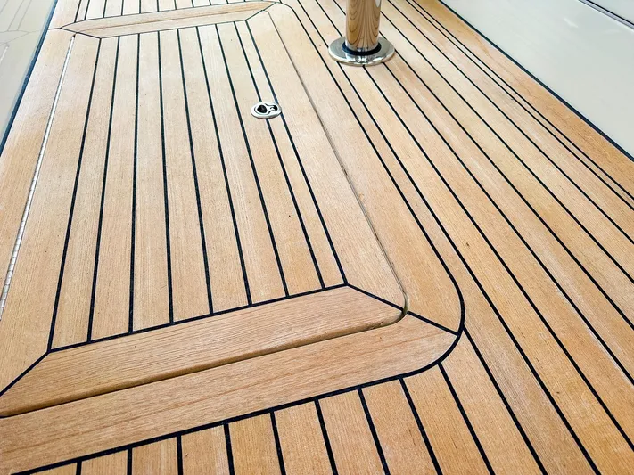 4750fr Yacht Photos Pics Teak deck of 2012 MJM 40z Downeast boat, featuring sleek, polished wood finish.