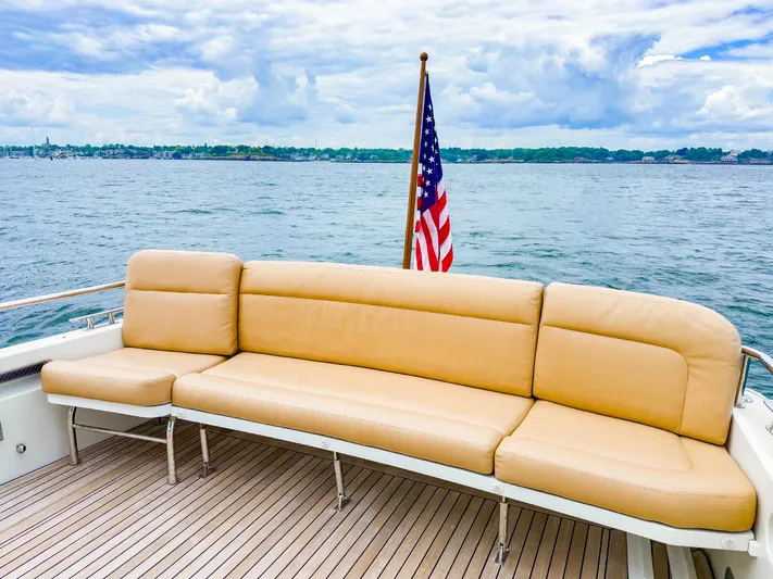 4750fr Yacht Photos Pics Luxury seating on 2012 MJM 40z Downeast yacht with American flag and ocean view.