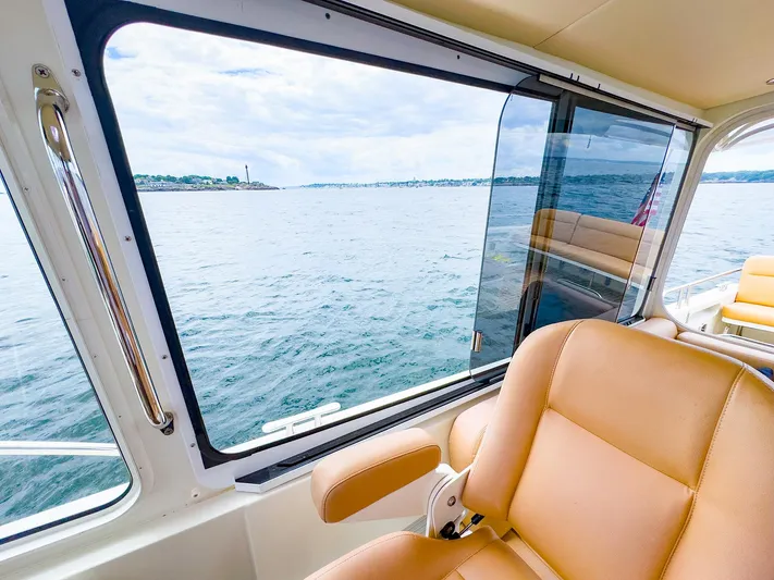 4750fr Yacht Photos Pics Interior view of 2012 MJM 40z Downeast boat with ocean scenery through window.