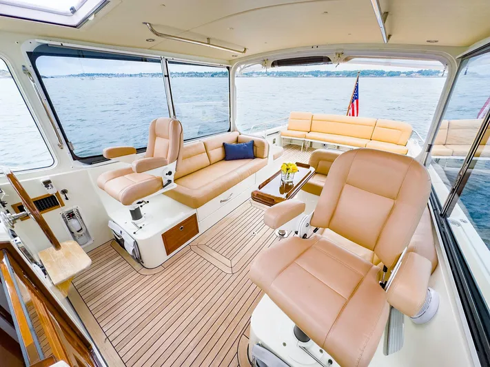 4750fr Yacht Photos Pics Luxurious interior of 2012 MJM 40z Downeast yacht with plush seating and scenic ocean view.