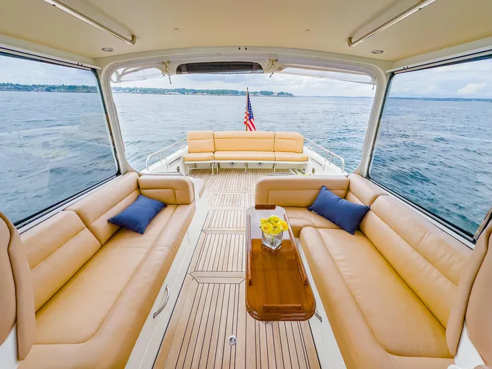 4750fr Yacht Photos Pics Luxurious 2012 MJM 40z Downeast yacht interior with tan seating and ocean view.