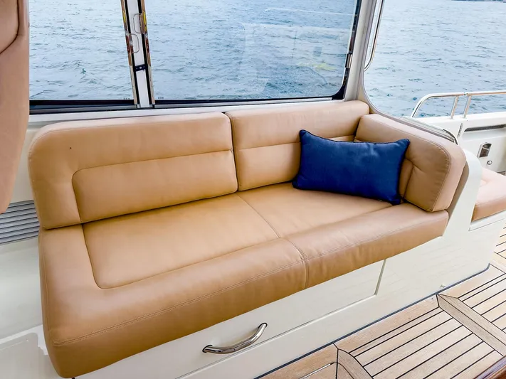 4750fr Yacht Photos Pics Luxurious tan leather seating on 2012 MJM 40z Downeast yacht with blue cushion.