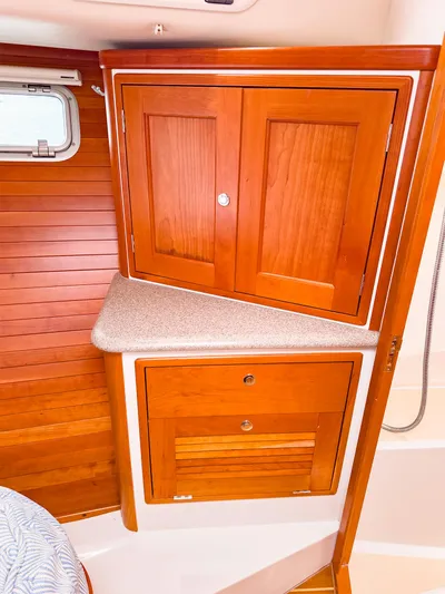 4750fr Yacht Photos Pics 2012 MJM 40z Downeast yacht interior with wooden cabinets and countertop.