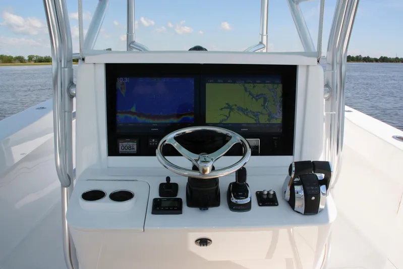 Teasin' II Yacht Photos Pics 2019 Bahama 41 Center Console boat helm with dual navigation screens and controls.