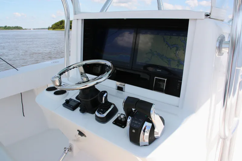 Teasin' II Yacht Photos Pics 2019 Bahama 41 Center Console boat helm with navigation screens and controls.