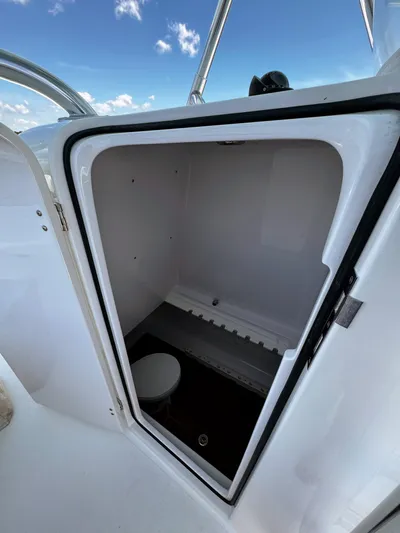 Teasin' II Yacht Photos Pics 2019 Bahama 41 Center Console boat interior storage compartment with toilet.