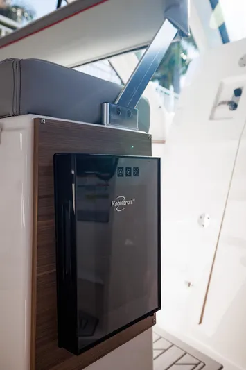  Yacht Photos Pics Solara S-310 SB 2026 boat interior with Koolatron cooler and seating.