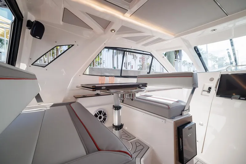  Yacht Photos Pics Luxurious interior of 2026 Solara S-310 SB boat with modern seating and sleek design.