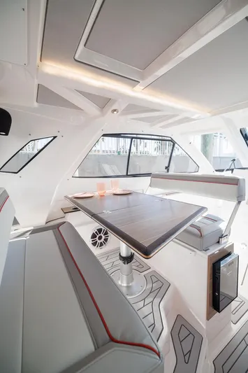  Yacht Photos Pics Interior of 2026 Solara S-310 SB boat with modern seating and dining area.
