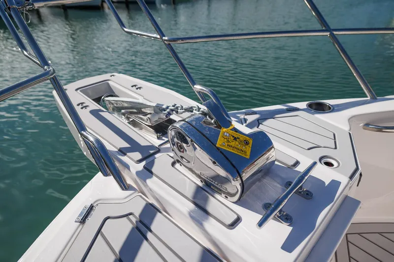  Yacht Photos Pics 2026 Solara S-310 SB boat anchor system on deck, docked in calm waters.